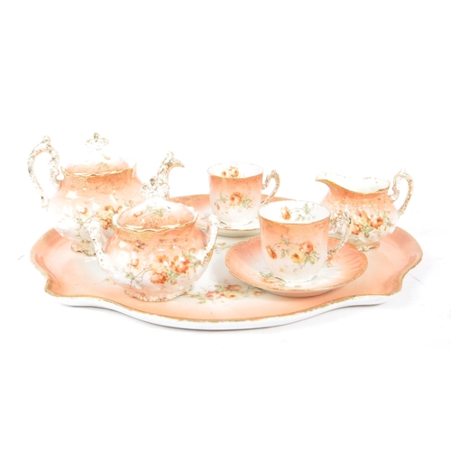 121 - An early 20th Century Edwardian china porcelain breakfast / tea service in blush pink with floral ro... 