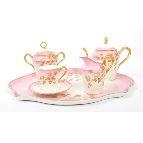 123 - An early 20th Century Edwardian china porcelain bachelor service in white and pink ground with gilt ... 