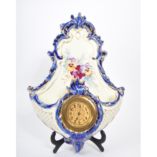 129 - Sitzendorf - A late 19th Century Sitzendorf porcelain mantel clock in pastel pink and blue ground wi... 