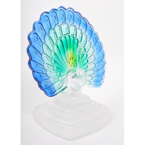 136 - A contemporary studio art glass ornament in the form of a peacock bird. Having green and blue feathe... 