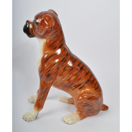 149 - Just Cats & Co - Stoke on Trent, England. A ceramic figure / ornament in the form of an English Boxe... 