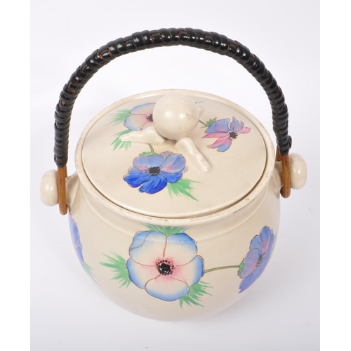 152 - Clarice Cliff - A retro 20th century ceramic pottery cauldron / handled pot. Having a twisted carry ... 