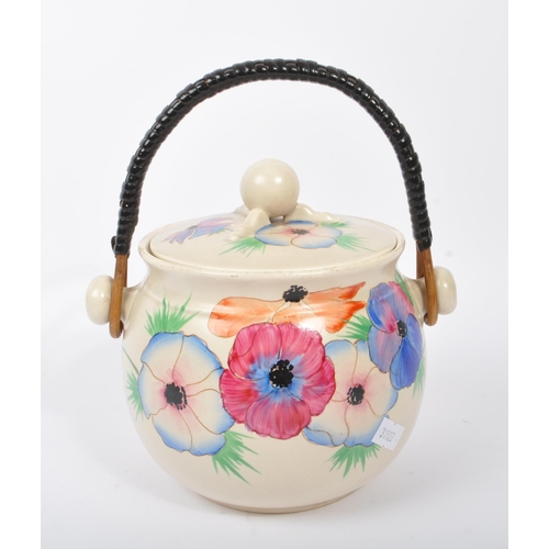 152 - Clarice Cliff - A retro 20th century ceramic pottery cauldron / handled pot. Having a twisted carry ... 