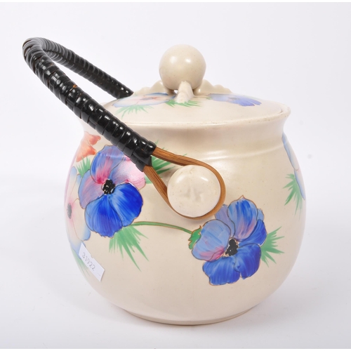 152 - Clarice Cliff - A retro 20th century ceramic pottery cauldron / handled pot. Having a twisted carry ... 