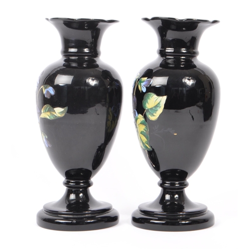 154 - Two early 20th Century Edwardian bohemian era black glass baluster vase with enamelled floral blue a... 