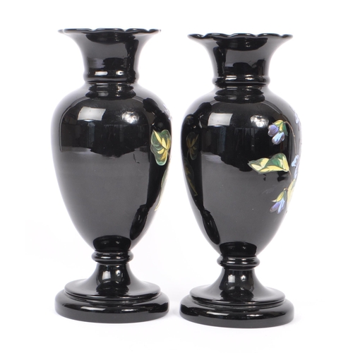 154 - Two early 20th Century Edwardian bohemian era black glass baluster vase with enamelled floral blue a... 