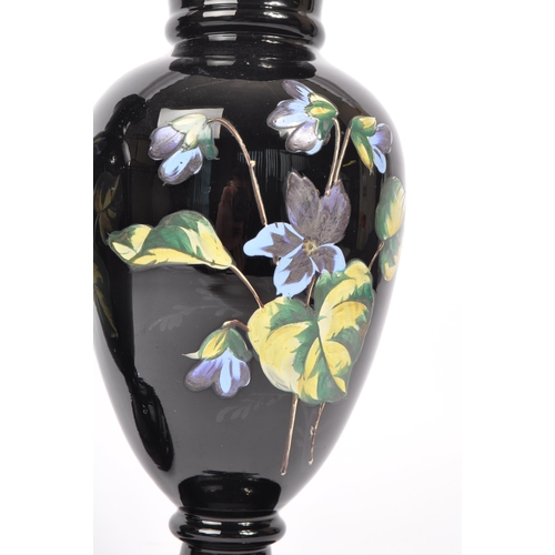 154 - Two early 20th Century Edwardian bohemian era black glass baluster vase with enamelled floral blue a... 