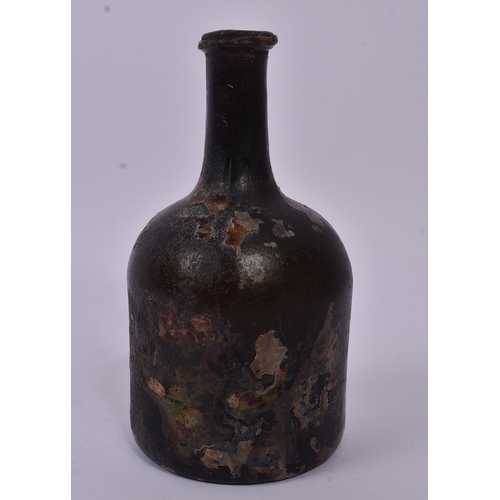 158 - An 18th century circa 1700s glass ship wreck wine bottle. The glass being of mallet type form and ir... 