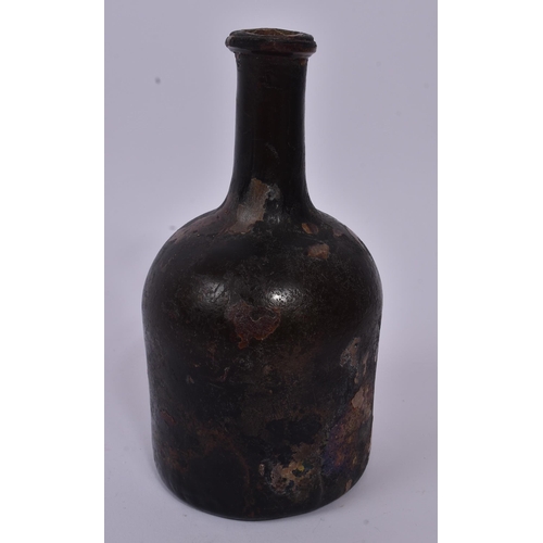 158 - An 18th century circa 1700s glass ship wreck wine bottle. The glass being of mallet type form and ir... 