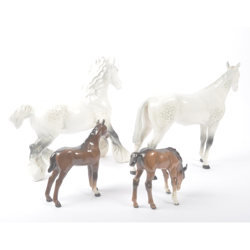 185 - Beswick - A collection of four porcelain china. Comprising grey mare model, two smaller brown foals ... 