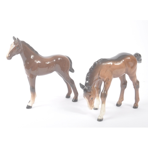 185 - Beswick - A collection of four porcelain china. Comprising grey mare model, two smaller brown foals ... 