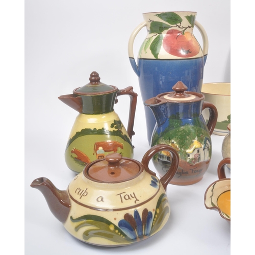 189 - Torquay Pottery / Motto Wares - A collection of ceramic pottery items. To include, large double hand... 