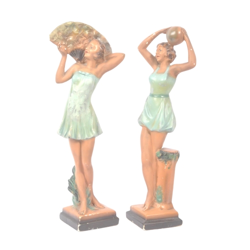 190 - A pair of early 20th century Art Deco chalk dancing lady figurines. The figures each stood posed in ... 