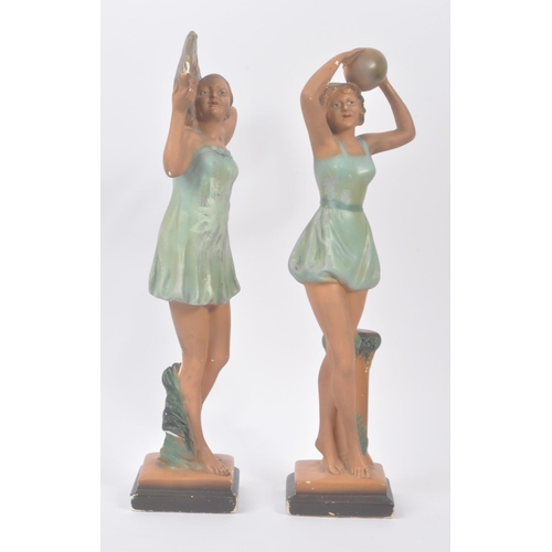 190 - A pair of early 20th century Art Deco chalk dancing lady figurines. The figures each stood posed in ... 