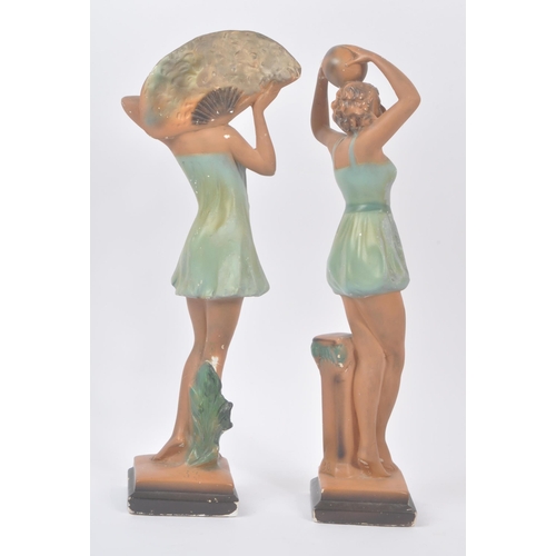 190 - A pair of early 20th century Art Deco chalk dancing lady figurines. The figures each stood posed in ... 