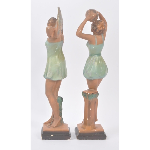 190 - A pair of early 20th century Art Deco chalk dancing lady figurines. The figures each stood posed in ... 