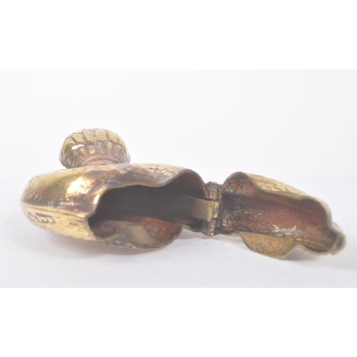 191 - A vintage 20th century gilt metal vesta case in the form of a curled snake. Measures approx. 4.4cm l... 