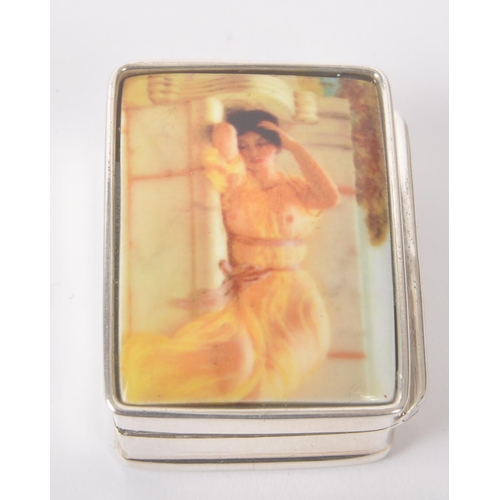 193 - A vintage 20th century silver pill box with semi nude enamelled lady to hinged lid. Measures approx.... 