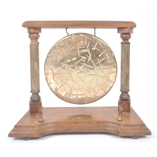 196 - A vintage 20th century brass Burmese table gong mounted on wooden base / frame. Having metal shield ... 