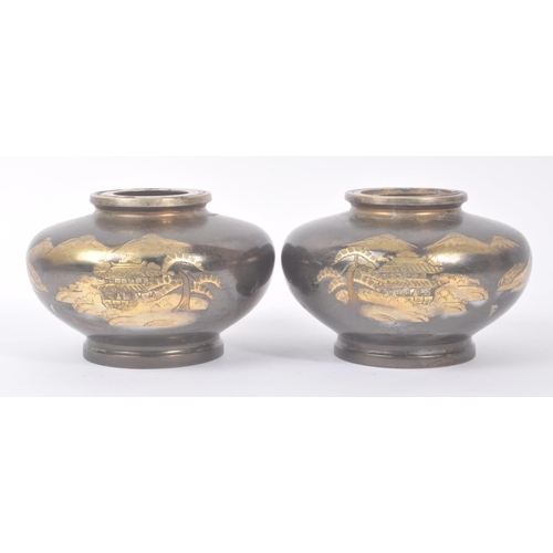 197 - A pair of early 20th century Japanese squat brass vases, alongside another contemporary example. The... 