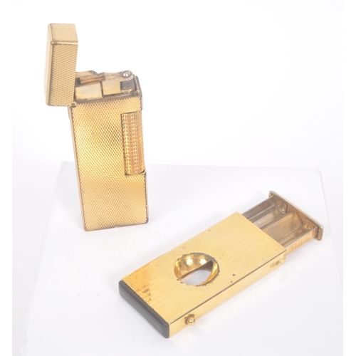 198 - Dunhill - A 20th century Dunhill Swiss made cigarette lighter. The lighter having engine turned fini... 