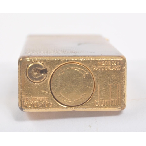 198 - Dunhill - A 20th century Dunhill Swiss made cigarette lighter. The lighter having engine turned fini... 