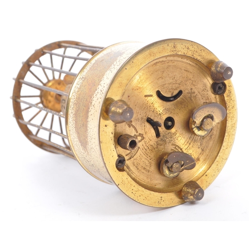 201 - A mid 20th century circa 1950s  clock modelled as a bird in a brass cage. A brass case cage clock wi... 