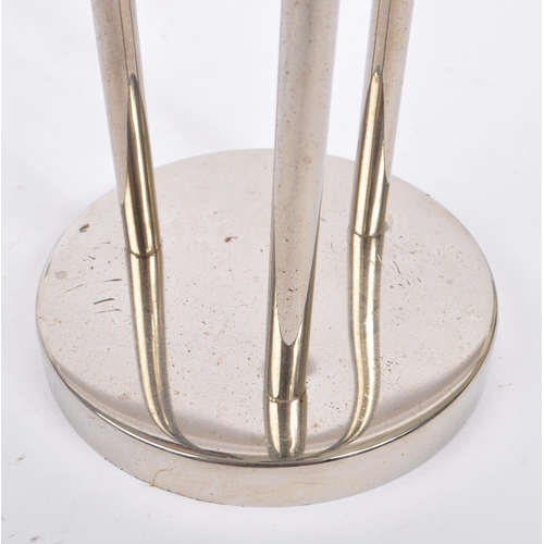 202 - A collection of 1980s and later late 20th century stainless steel candle holders. The lot to include... 