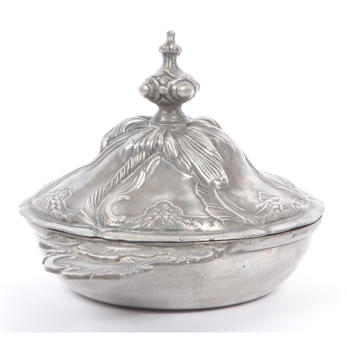 204 - A 19th Century continental pewter lidded art nouveau pot with raised floral and leaf design and fini... 