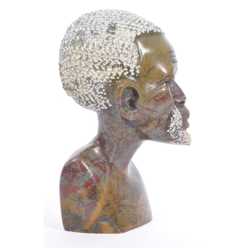 208 - A vintage late 20th century African stone soap carving of a male bust. Measures 15cm tall.