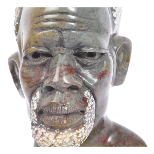 208 - A vintage late 20th century African stone soap carving of a male bust. Measures 15cm tall.