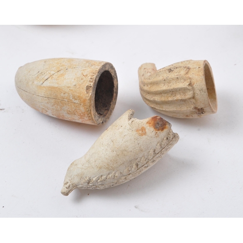 217 - Collection of 19th century clay pipes. To include a carved African gentlemen atop a pipe. Eight in t... 