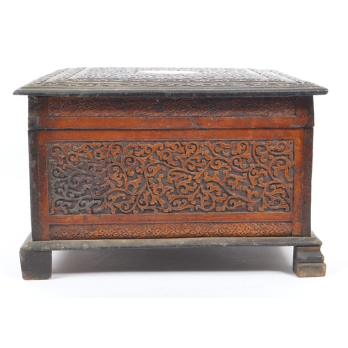 218 - A vintage 20th century Kashmiri carved camphor wood box. With dense foliate repeating carved patter.... 