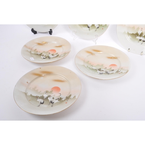 22 - A set of six 1920's Japanese side plates. Transfer printed in green and off white with stork, sun & ... 