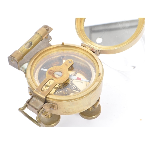 222 - A natural sine brass cased compass with spirit level by Stanley London. With attached natural sine t... 