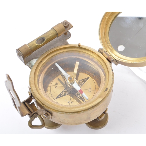 222 - A natural sine brass cased compass with spirit level by Stanley London. With attached natural sine t... 