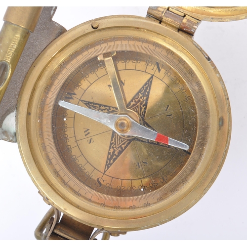 222 - A natural sine brass cased compass with spirit level by Stanley London. With attached natural sine t... 