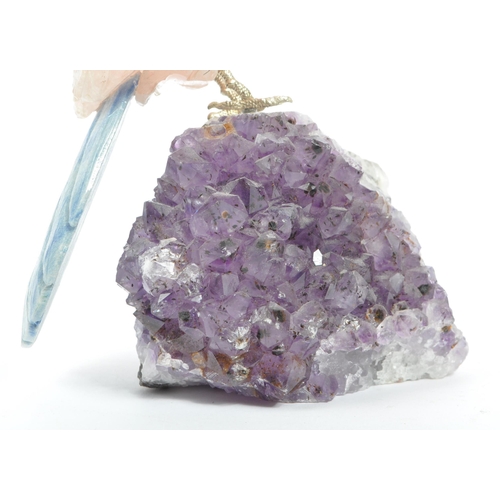 224 - A carved rose quartz parrot perched upon an amethyst crystal geode with textured white metal . Measu... 