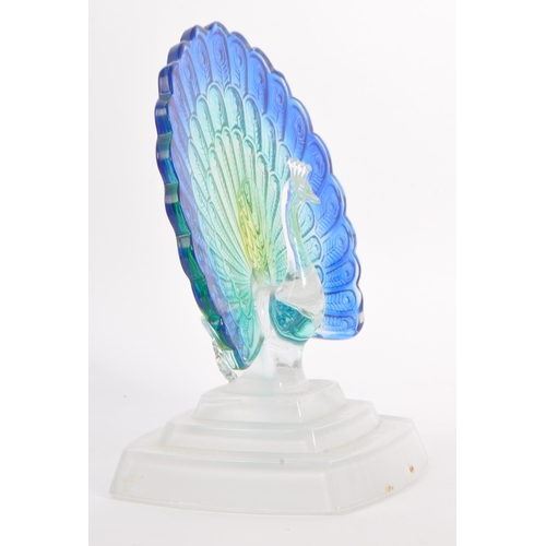 23 - A contemporary studio art glass ornament in the form of a peacock bird. Having green and blue feathe... 