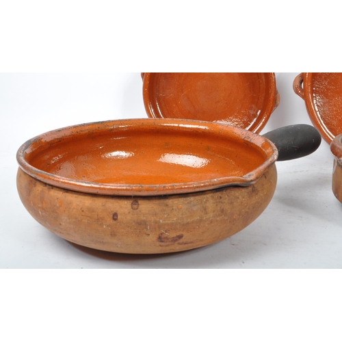 235 - A set of 10 vintage 20th century red clay French terracotta glazed tian bowls / dishes. Comprising o... 