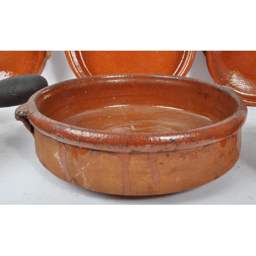 235 - A set of 10 vintage 20th century red clay French terracotta glazed tian bowls / dishes. Comprising o... 