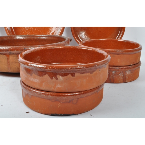 235 - A set of 10 vintage 20th century red clay French terracotta glazed tian bowls / dishes. Comprising o... 