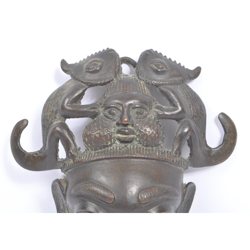 244 - A 20th century North African Cameroon bronze mask - Tikun/Bamun people. Having twin reptiles / chame... 