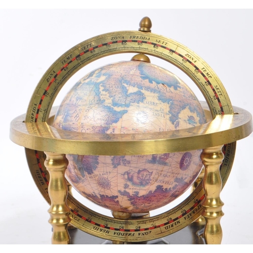 245 - A vintage 20th century desk top globe standing on metal supports finished with decorative brass plat... 