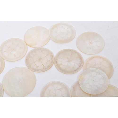 254 - A large collection of 19th century Chinese engraved mother of pearl games tokens / counters. The cou... 