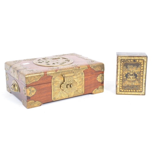 255 - A 20th century Chinese brass bound jewellery box alongside another lacquered example. The box having... 