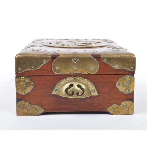 255 - A 20th century Chinese brass bound jewellery box alongside another lacquered example. The box having... 