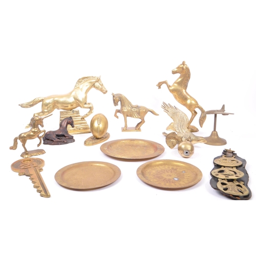 263 - A collection of assorted 20th century decorative brass items. The collection to include brass paperw... 