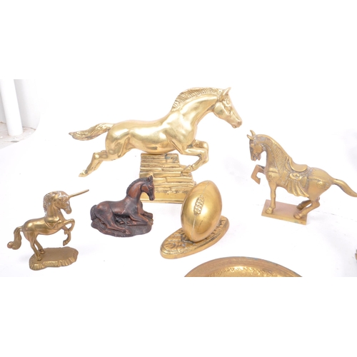 263 - A collection of assorted 20th century decorative brass items. The collection to include brass paperw... 