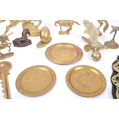 263 - A collection of assorted 20th century decorative brass items. The collection to include brass paperw... 